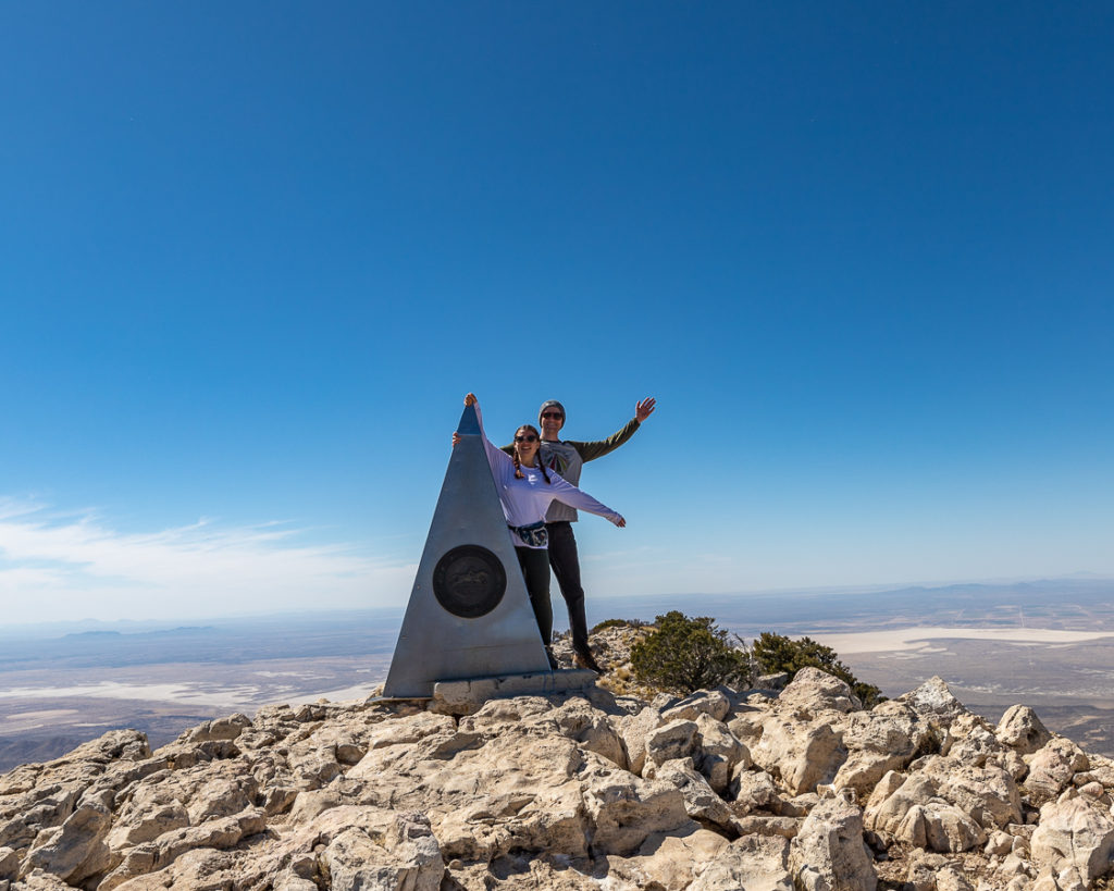 Spencer and Alexis pose next to the metal pyramid signifying the highest point in Texas.