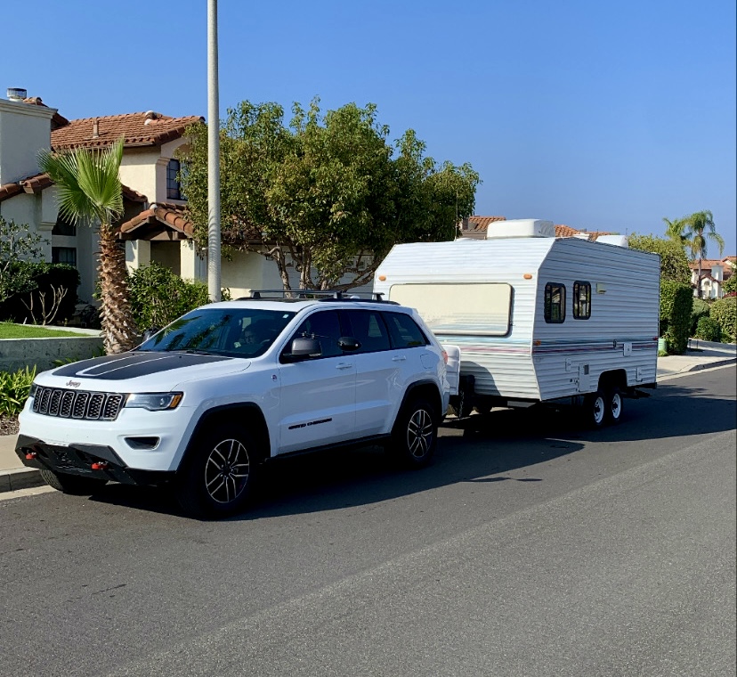 A Jeep Grand Cherokee towing a 1995 Skyline Nomad Travel Trailer.